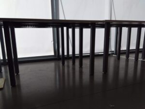 Art campus A: grey floors stark walls and tables