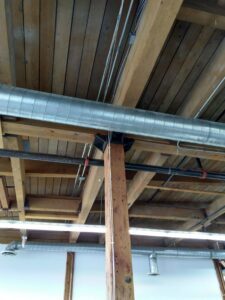 Campus B wooden ceiling softens metal pipework
